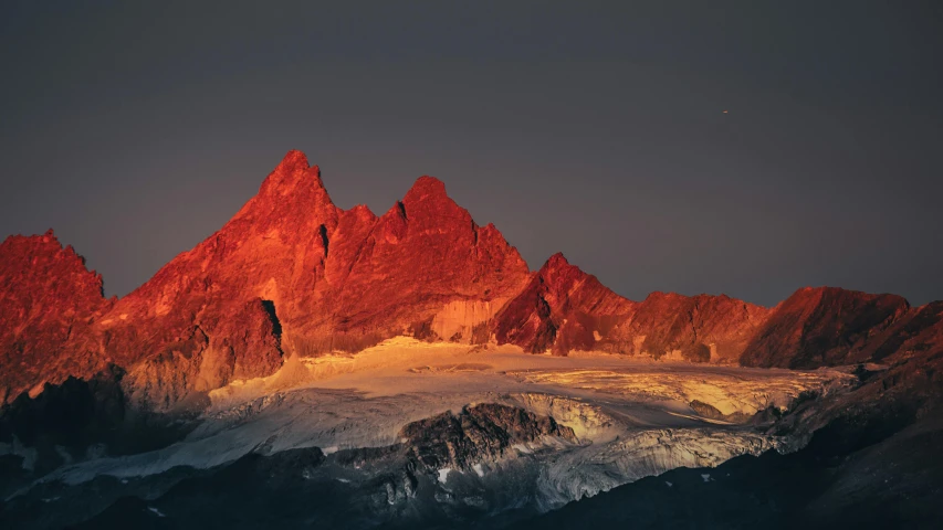 the sun is setting on the top of a mountain, a matte painting, by Karl Gerstner, unsplash contest winner, minimalism, vibrant red 8k, chamonix, geology, photo taken at night