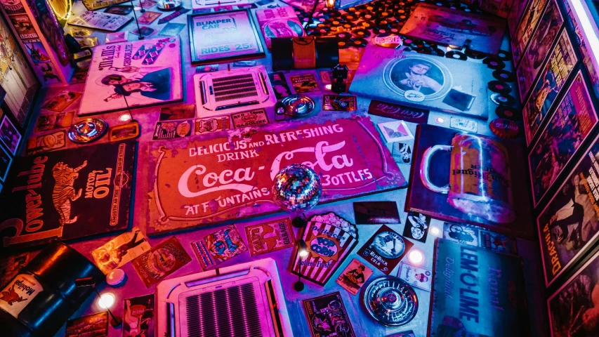 a pinball machine sitting on top of a table, an album cover, by Matt Cavotta, pexels contest winner, maximalism, nuka cola, neon electronic signs, [ overhead view of a table ]!!, cyberpunk artifacts