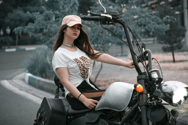 a woman sitting on the back of a motorcycle, pexels contest winner, graphic tees, wearing a round helmet, avatar image, half body cropping