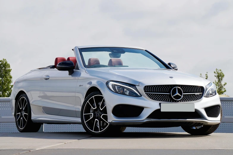 a white mercedes convertible parked in a parking lot, pexels contest winner, gleaming silver, avatar image, front angle, black car