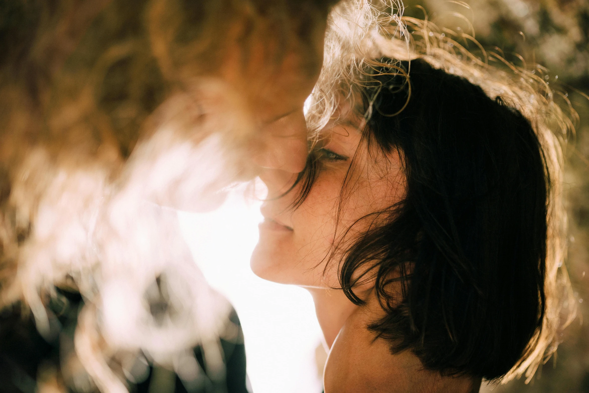 a woman with her hair blowing in the wind, pexels contest winner, romanticism, peasant boy and girl first kiss, light from bottom, woman with freckles, indoor picture