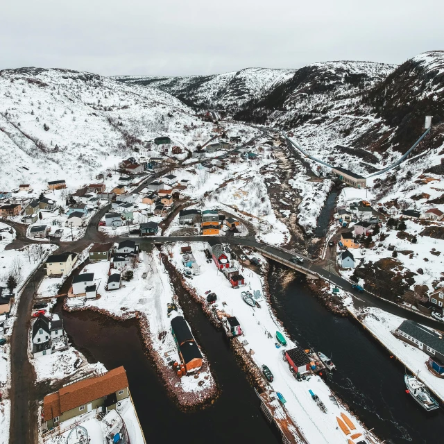 an aerial view of a small town covered in snow, by Jesper Knudsen, pexels contest winner, hurufiyya, small port village, canyon, black, thumbnail