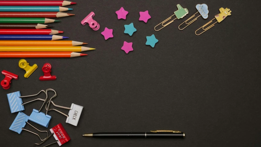 a bunch of colored pencils sitting on top of a table, by Julia Pishtar, pexels contest winner, academic art, chalkboard, paper cutouts of plain colors, various items, brown and pink color scheme