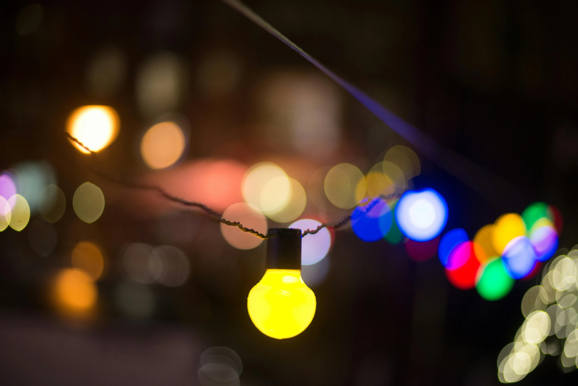 a close up of a string of lights, inspired by Elsa Bleda, unsplash, yellow, multi - coloured, outdoor lighting, multicolored