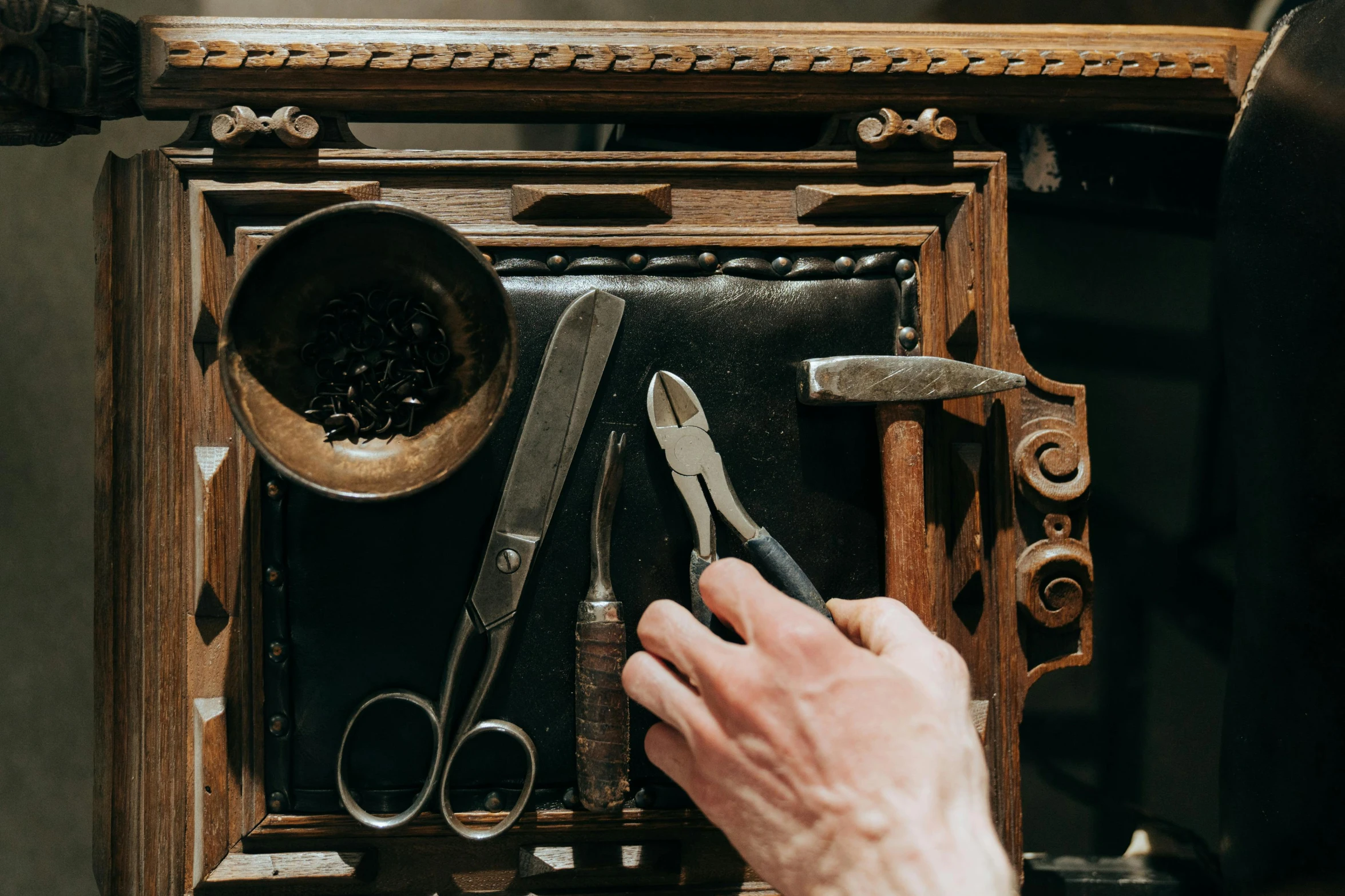 a close up of a person holding a pair of scissors, a woodcut, trending on pexels, arts and crafts movement, ancient coffee machine, cursed baroque with ebony inlay, thumbnail, apothecary