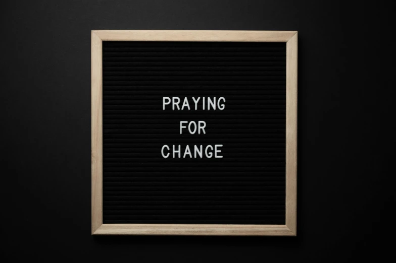 a letter board with the words praying for change written on it, a picture, trending on pexels, 1 6 x 1 6, panel of black, sustainable, nd 4