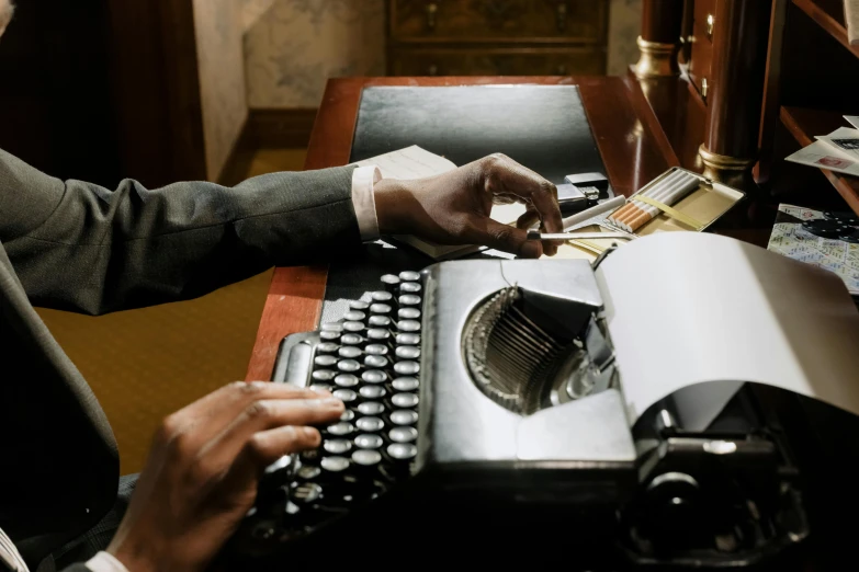 a man in a suit typing on a typewriter, an album cover, unsplash, hotel room, historical fiction, ( ( theatrical ) ), augusta savage