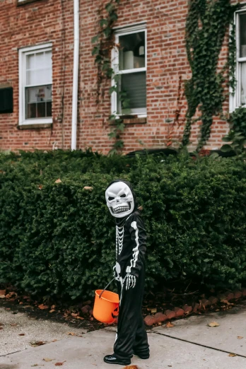 a little boy dressed up as a skeleton with a trick bag, a statue, pexels contest winner, neighborhood, straight neck, small, no teeth