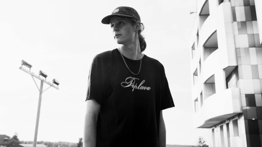 a black and white photo of a person with a skateboard, outlive streetwear collection, wearing black tshirt, alpha, delicacy