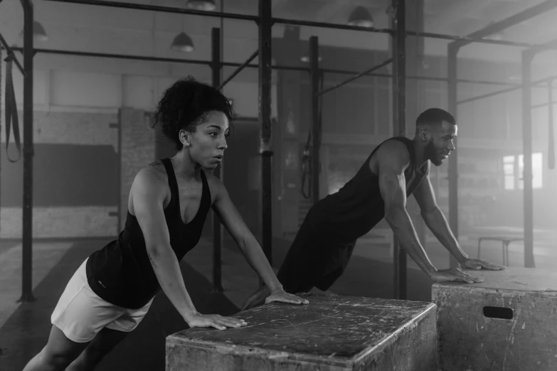 a man and a woman doing push ups in a gym, a portrait, by Emma Andijewska, figuration libre, vfx shot, ashteroth, square, ad image