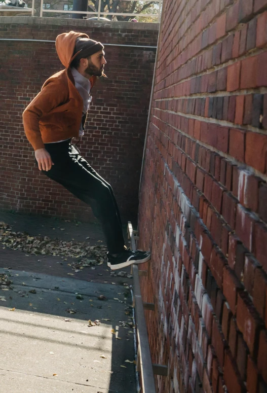a man flying through the air while riding a skateboard, by Jan Tengnagel, unsplash, happening, hiding behind a brick wall, man in adidas tracksuit, athletic tall handsome guys, bending down slightly