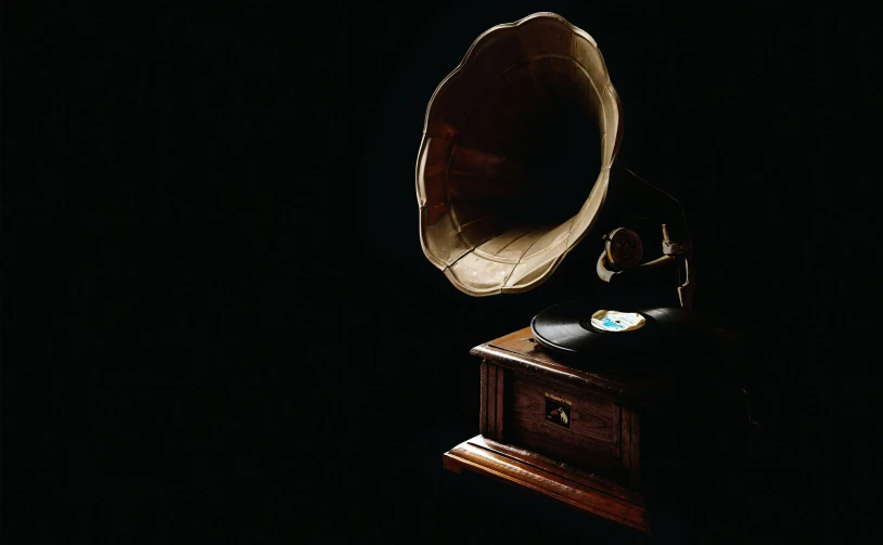 a gramphone sitting on top of a wooden table, an album cover, by Everett Warner, pexels contest winner, in front of a black background, musee d'orsay 8 k, [ cinematic, roaring