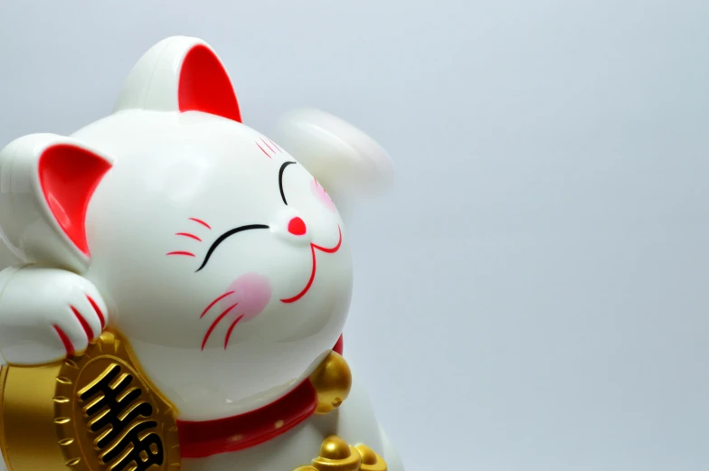 a close up of a figurine of a cat, inspired by Miao Fu, trending on unsplash, cat is floating in air, white background”, god of wealth, animation