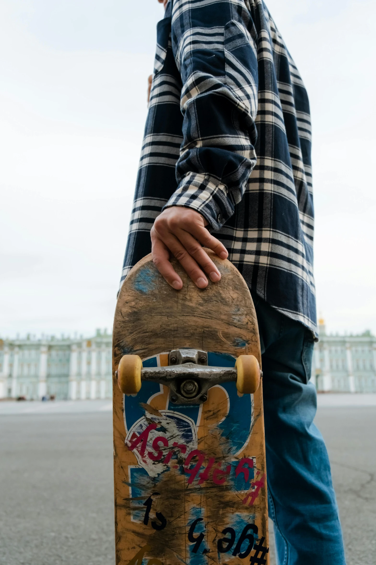 a close up of a person holding a skateboard, kremlin, curated collections, guide, extra wide