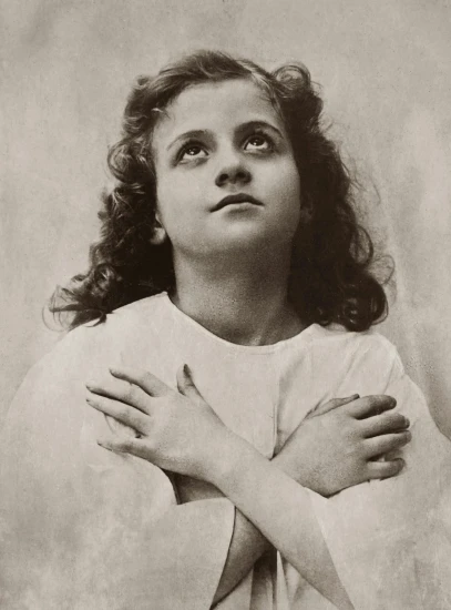 a black and white photo of a woman with her arms crossed, an album cover, by Joseph Kleitsch, pre-raphaelitism, prayer hands, beautiful little girl, joey king, looking upwards
