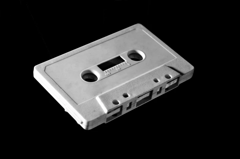 a black and white photo of a cassette, an album cover, made out of shiny white metal, ffffound, vibrant.-h 704, hip hop