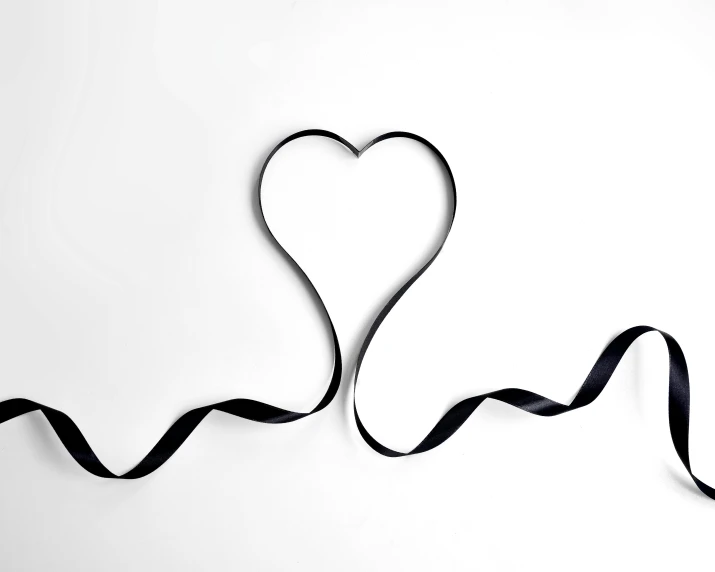 a black ribbon in the shape of a heart on a white background, by Gavin Hamilton, pexels, essence, thin lines, monitor, 15081959 21121991 01012000 4k