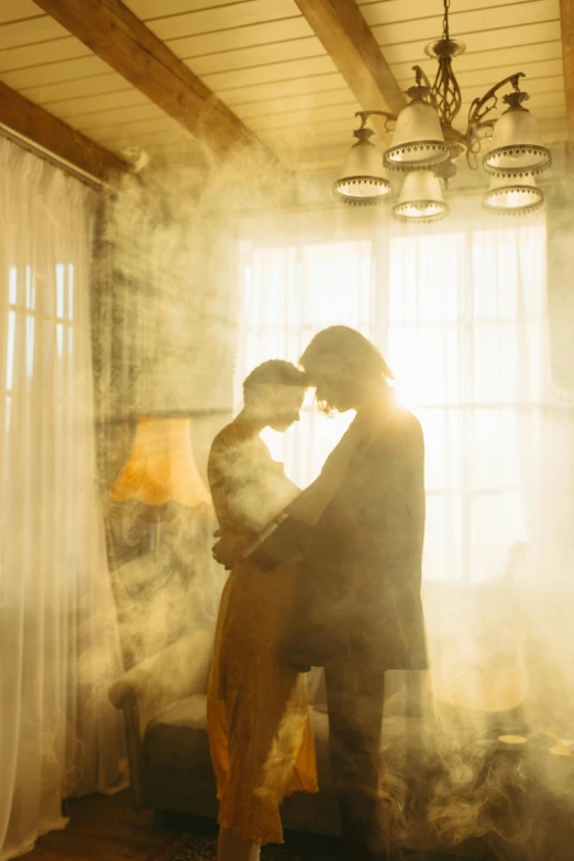 a man and a woman standing in front of a window, unsplash contest winner, romanticism, ray of light through smoke, yellow mist, making out, indoor scene