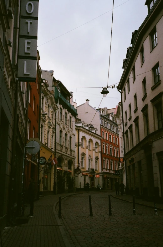 a city street filled with lots of tall buildings, baroque, old town, atmospheric photograph, square, chillhop