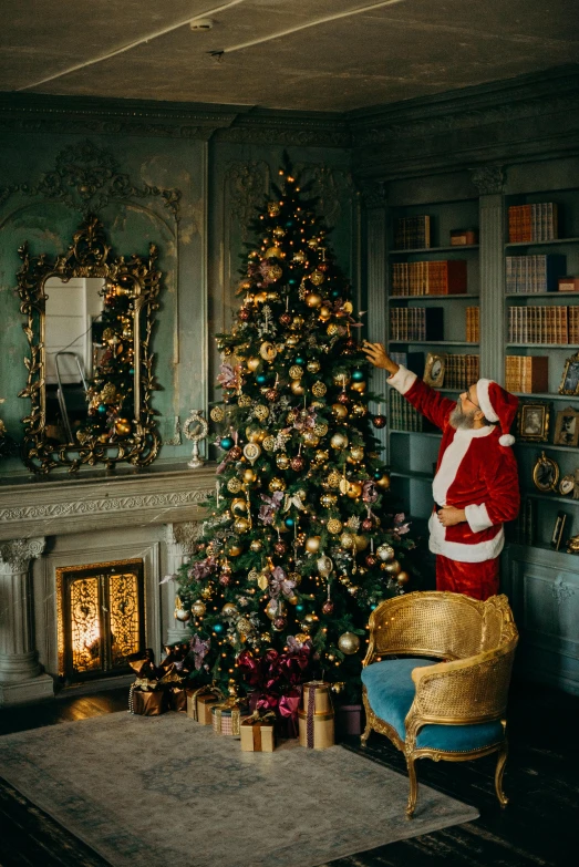 a santa clause decorating a christmas tree in a living room, a portrait, pexels, baroque, grand library, cyan and gold scheme, thumbnail, 1 9 2 0 s room