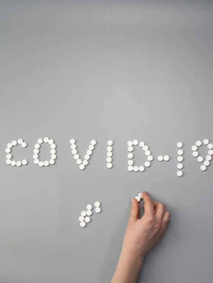 a person writing the word covidid on a wall, trending on pexels, pills, cute coronavirus creatures, thumbnail, white