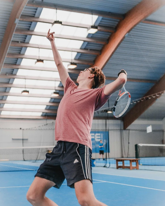 a man standing on top of a tennis court holding a racquet, inspired by Hans Mertens, pexels contest winner, happening, in the high school gym, caspar david, thumbnail, lachlan bailey