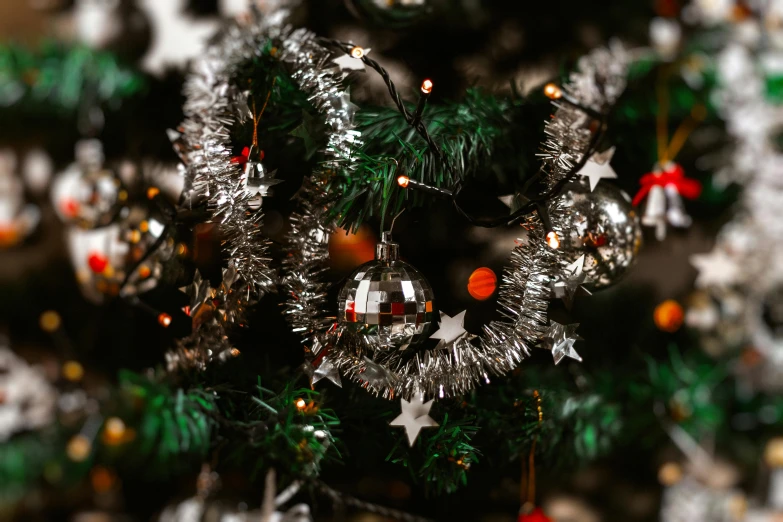 a close up of a christmas tree with decorations, pexels, hurufiyya, stainless steel, avatar image