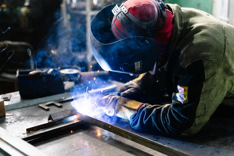 a welder working on a piece of metal, pexels contest winner, arbeitsrat für kunst, avatar image, lachlan bailey, instagram picture, rectangle