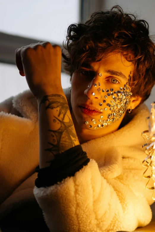 a close up of a person with glitter on their face, an album cover, robert sheehan, white cyborg fashion shot, eyepatches, model wears a puffer jacket