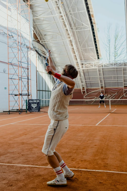 a man standing on top of a tennis court holding a racquet, inspired by Hans Mertens, happening, tocchini, indoor picture, terracotta, mid action swing