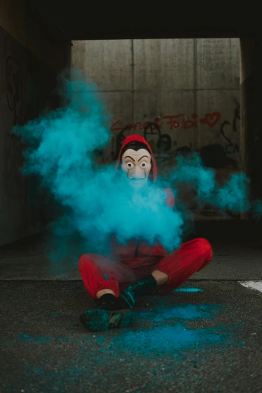 a man sitting on the ground with smoke coming out of his mouth, an album cover, inspired by Elsa Bleda, pexels contest winner, graffiti, red hood cosplay, wearing a track suit, red and cyan ink, mime