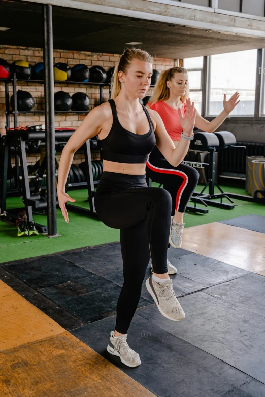 a group of women doing squats in a gym, by Adam Marczyński, pexels contest winner, sprinting, background image, low quality photo, thumbnail