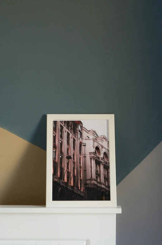 a picture of a building on top of a dresser, a polaroid photo, pexels contest winner, postminimalism, card frame, poster colour on canvas, detailed product image, low - angle shot from behind