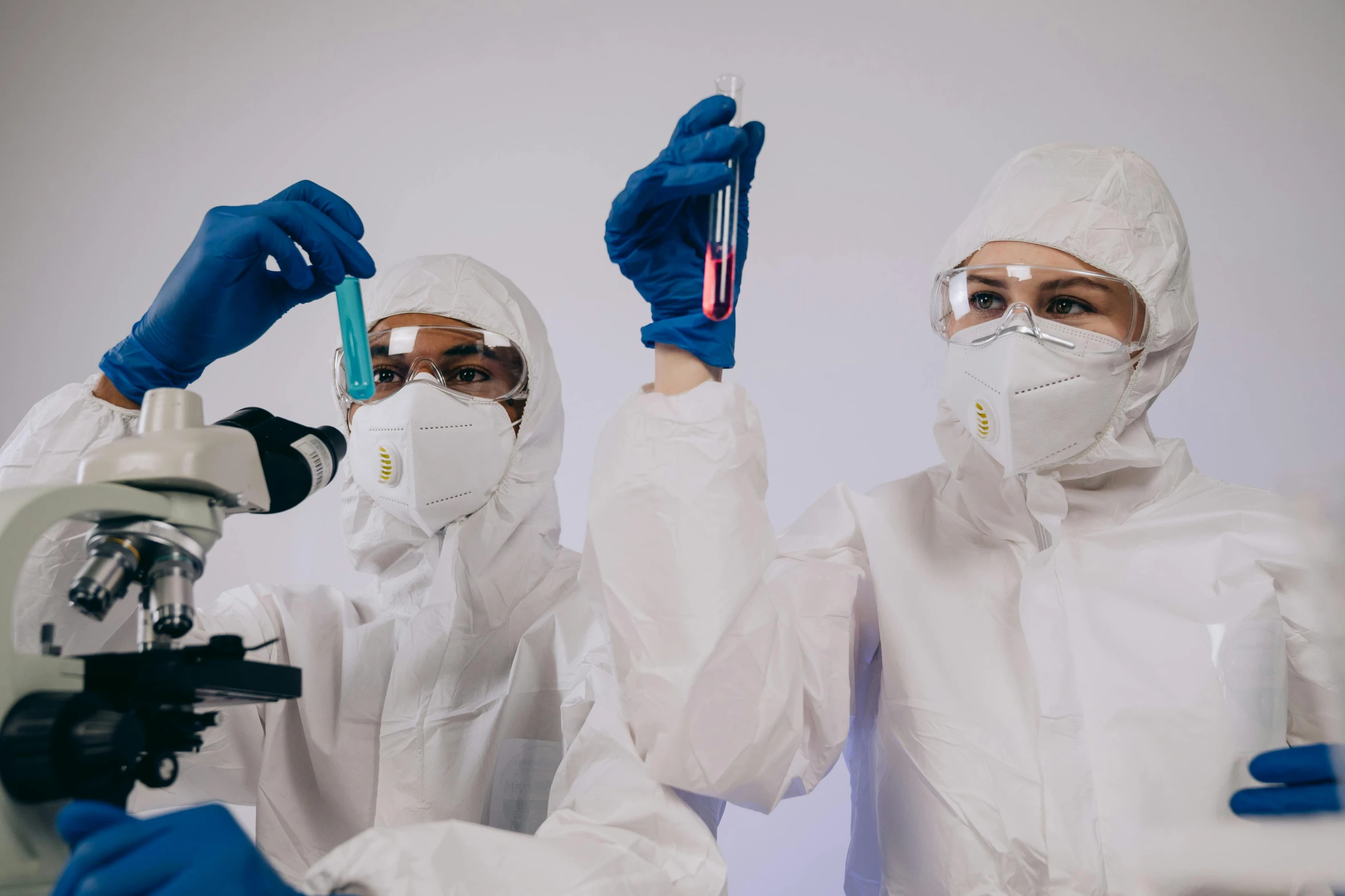 a couple of people that are standing in front of a microscope, trending on pexels, analytical art, staff wearing hazmat suits, holding syringe, high samples, thumbnail