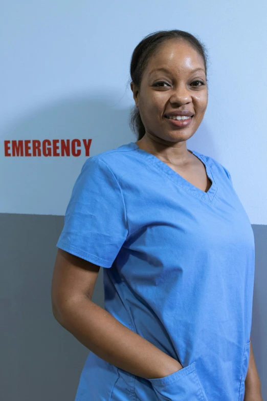 a woman in scrubs standing in front of an emergency sign, a portrait, flickr, photo of a black woman, promo image, large)}], product shot