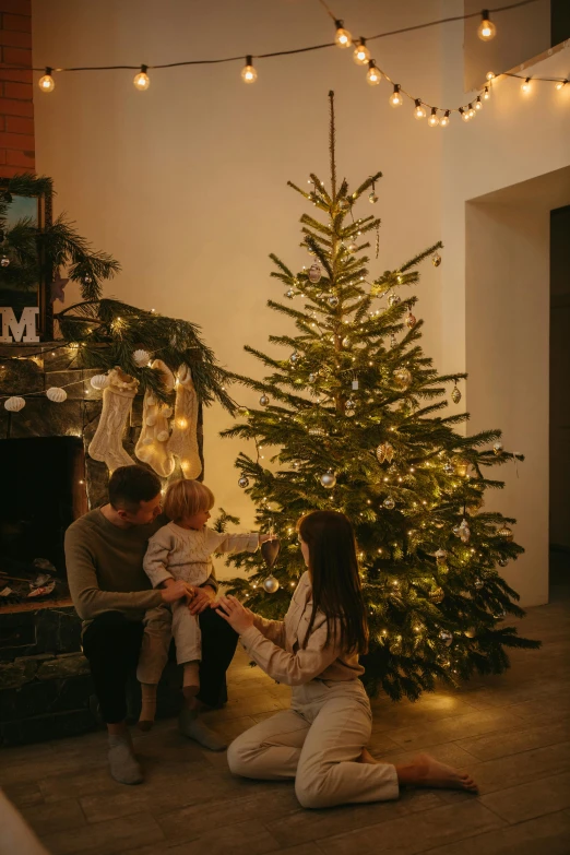 a group of people sitting around a christmas tree, cosy atmoshpere, profile image, mid morning lighting, fireplace lighting
