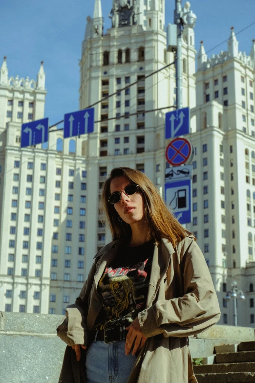 a woman standing in front of a tall building, gta in moscow, streetwear, in spain, andrea savchenko