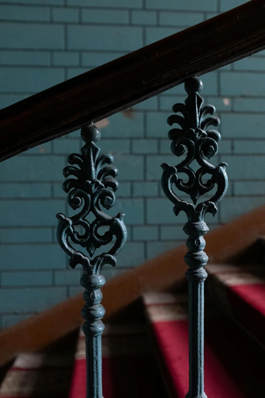 a set of stairs in a building with red carpet, inspired by Sydney Prior Hall, unsplash, baroque, cast iron material, verdigris, slate, victorian lace