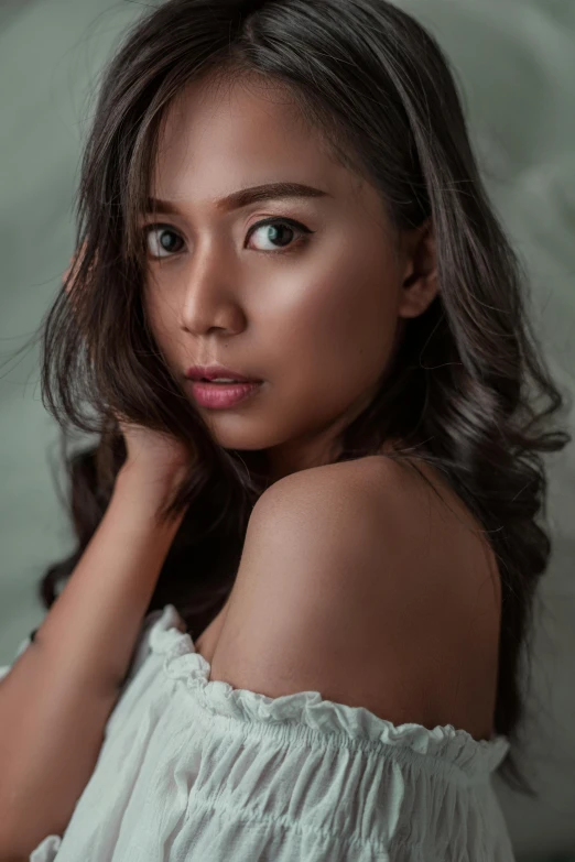 a woman in a white dress posing for a picture, inspired by Natasha Tan, pexels contest winner, photorealism, light green tone beautiful face, cindy avelino, indoor picture, grey