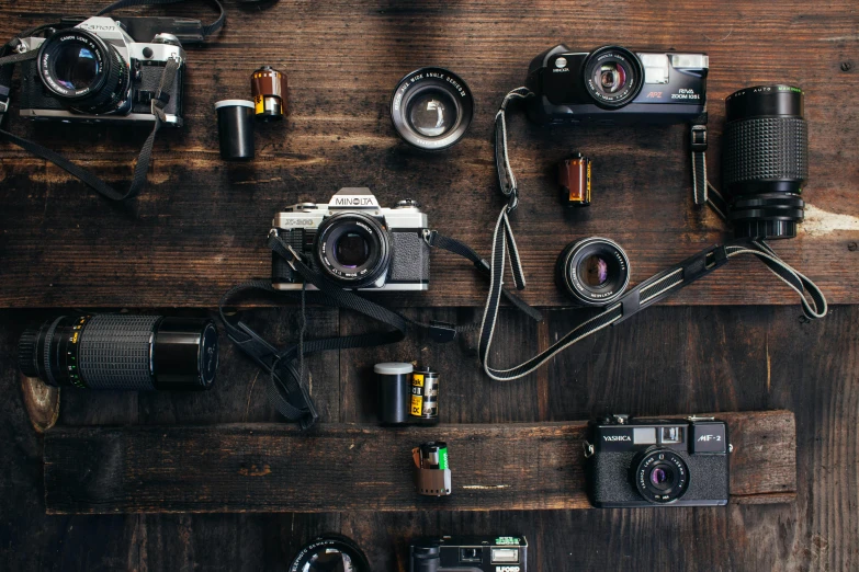 a group of cameras sitting on top of a wooden table, inspired by Elsa Bleda, flatlay, fan favorite, medium shot, medium format