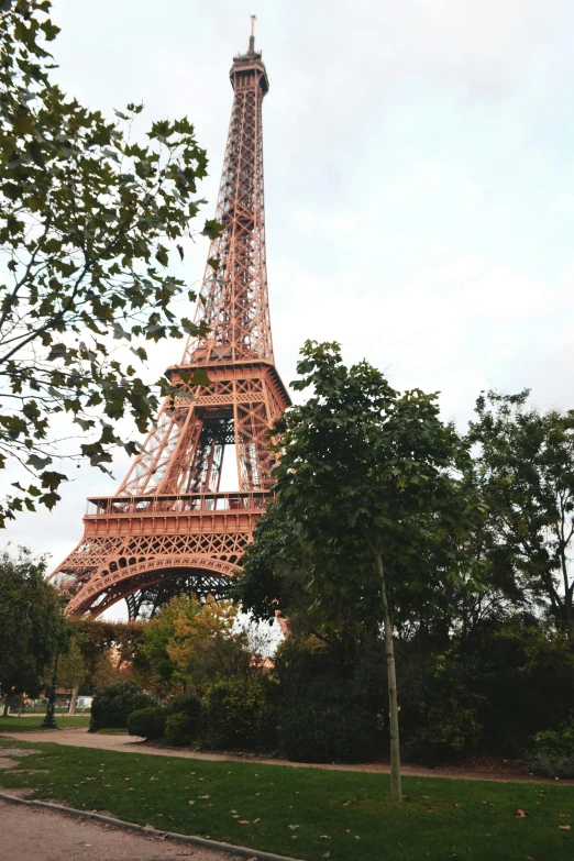 a view of the eiffel tower from a park, 8 k -, square, low quality photograph, 1km tall