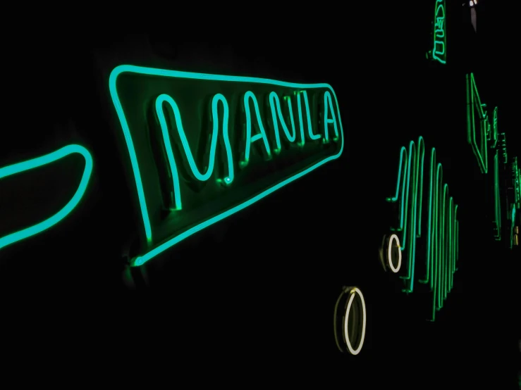 a close up of a neon sign on a wall, an album cover, by Manabu Mabe, mania, green light, manila, glowing heating coils