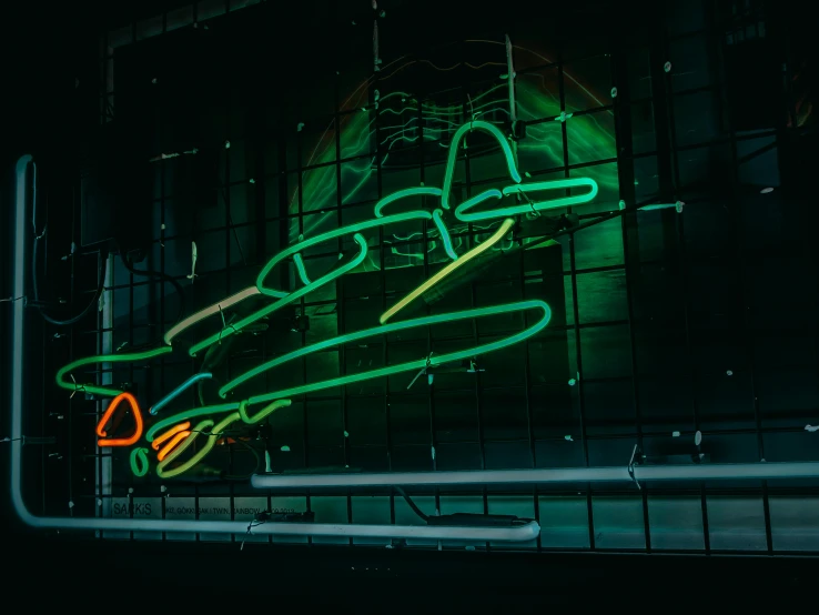a neon sign on the side of a building, inspired by Bruce Munro, pexels contest winner, graffiti, plane light, bumper cars, green lines, museum photo