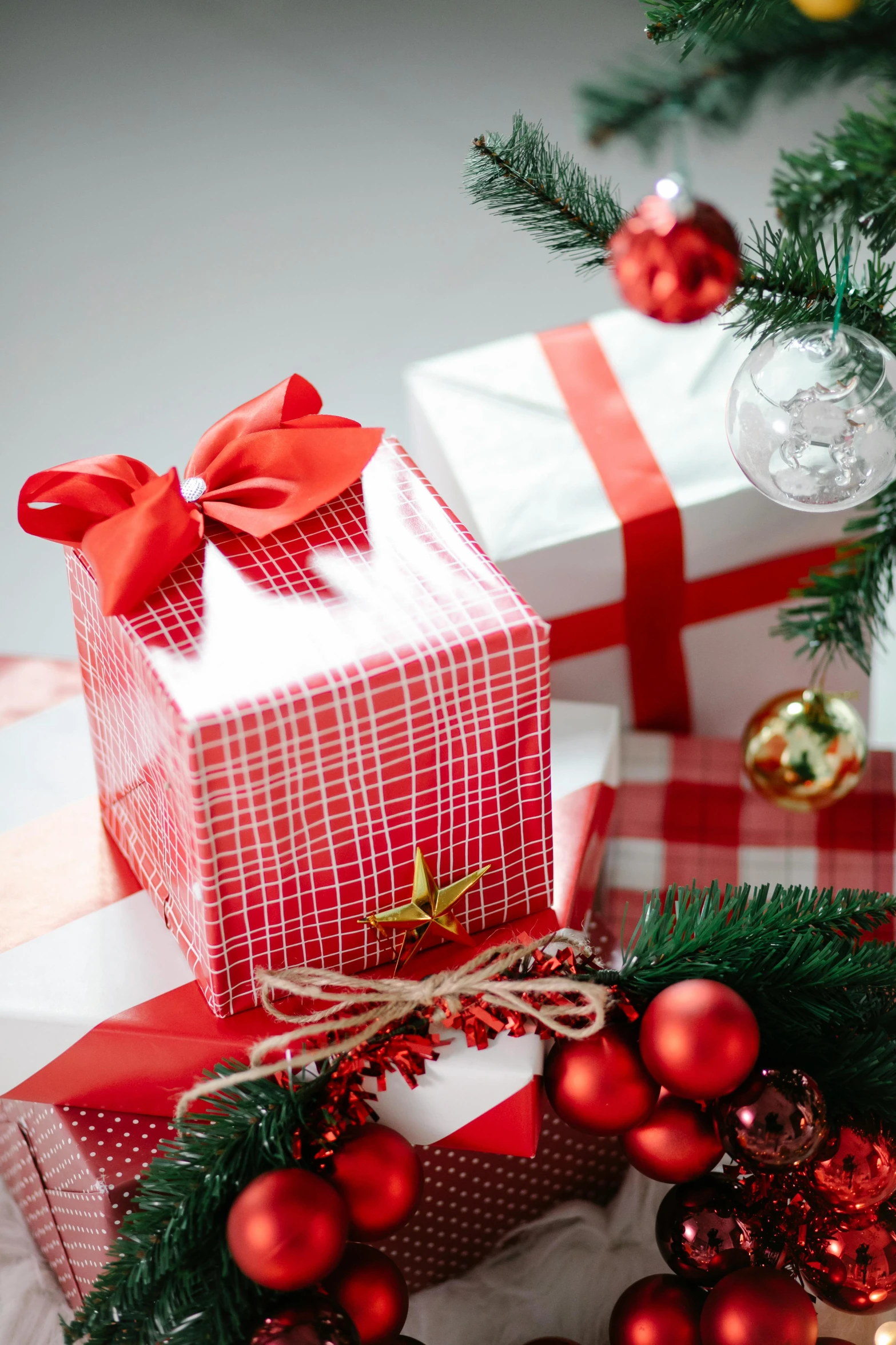 a pile of presents under a christmas tree, by Julia Pishtar, red white and gold color scheme, square, high quality photo, two