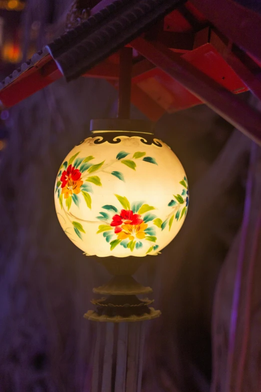 a close up of a lamp on a pole, inspired by Ma Lin, light inside the hut, flowery, inside a globe, dim lit