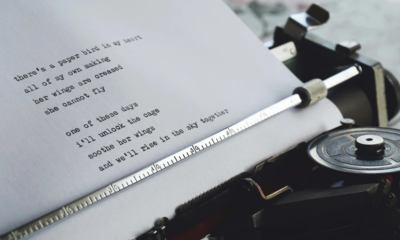 a close up of a typewriter with a sheet of paper, by Carey Morris, pexels contest winner, private press, concrete poetry, magical scene, bespoke, background image