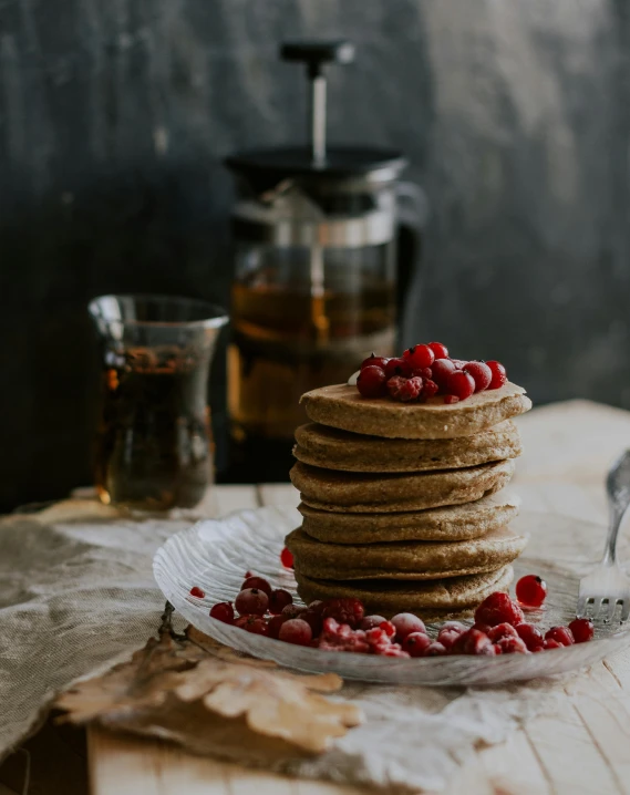 a stack of pancakes sitting on top of a glass plate, by Alice Mason, pexels contest winner, raspberry, botanicals, felt, celebration of coffee products