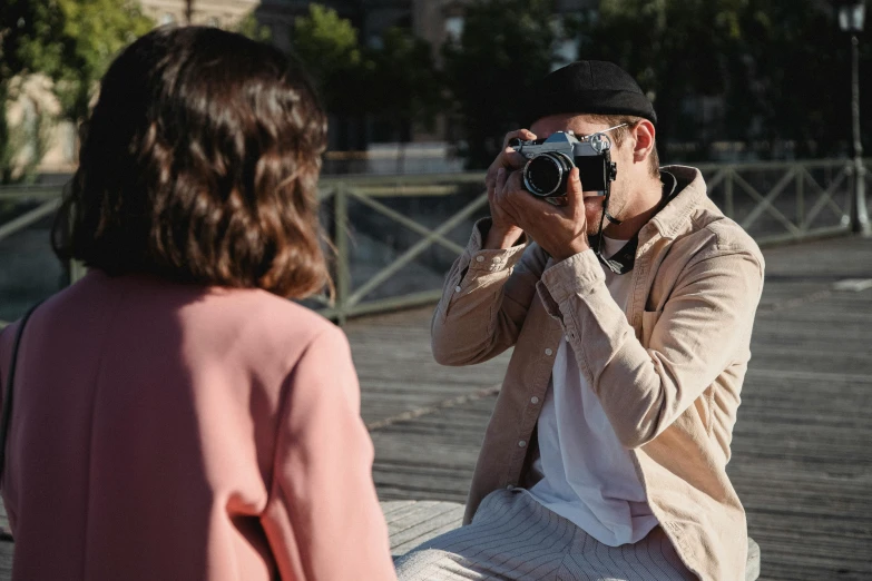 a man taking a picture of a woman with a camera, pexels contest winner, photoshoot for skincare brand, outdoor fine photography, sony a 7 siii, press paparazzi photograph