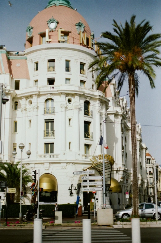 a large white building with a clock on top of it, inspired by Ramon Pichot, art nouveau, panorama view, palme d'or winner, 2 5 6 x 2 5 6 pixels, exterior shot