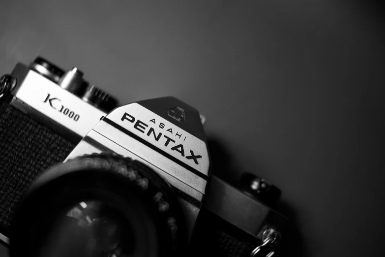 a black and white photo of a camera, by Petr Brandl, pexels contest winner, pentax 67, studio medium format photograph, eighties amateur photography, low angle!!!!